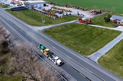 Truck Hauling Equipment on raod
