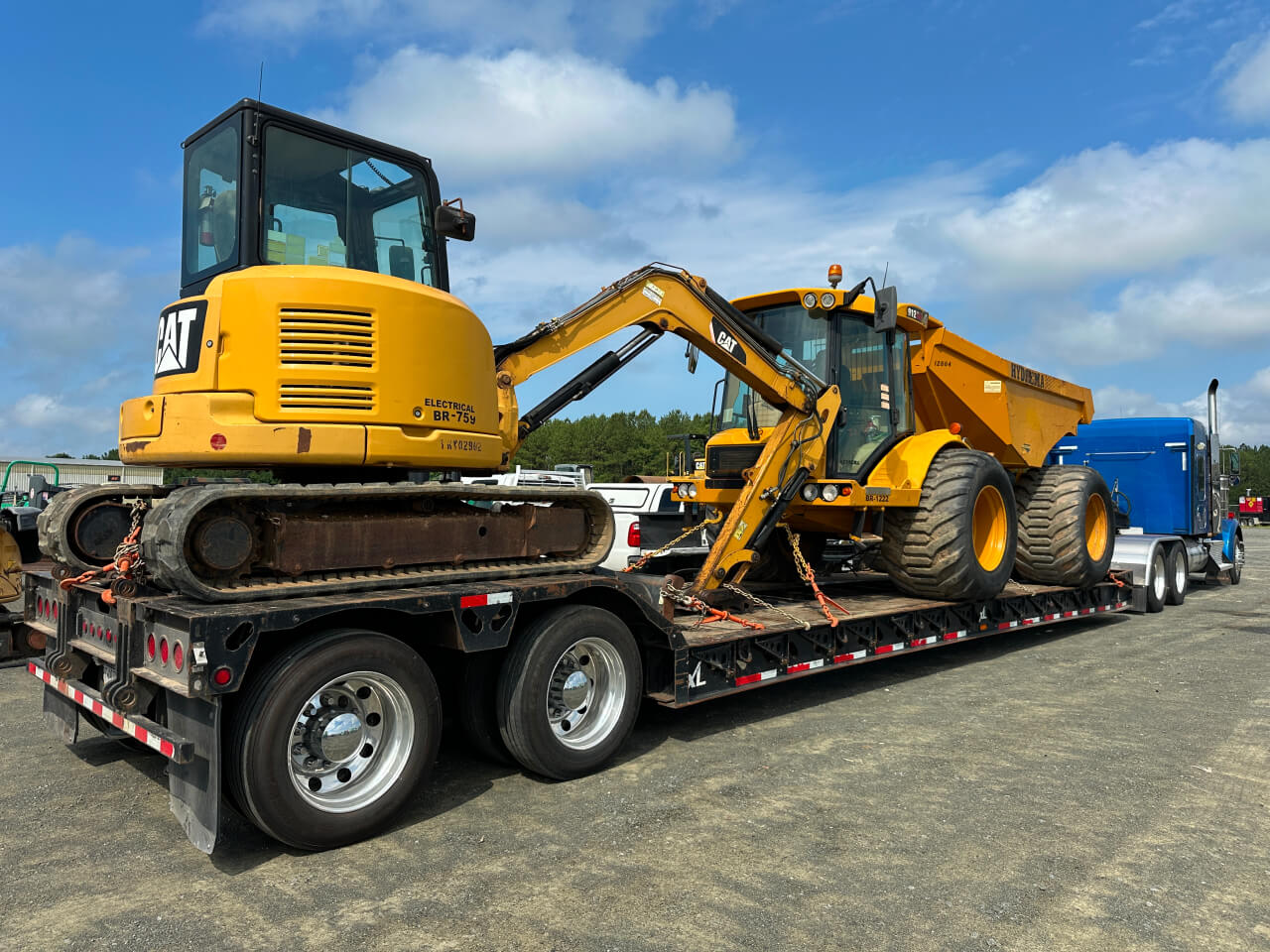 Truck Hauling CAT Excavator